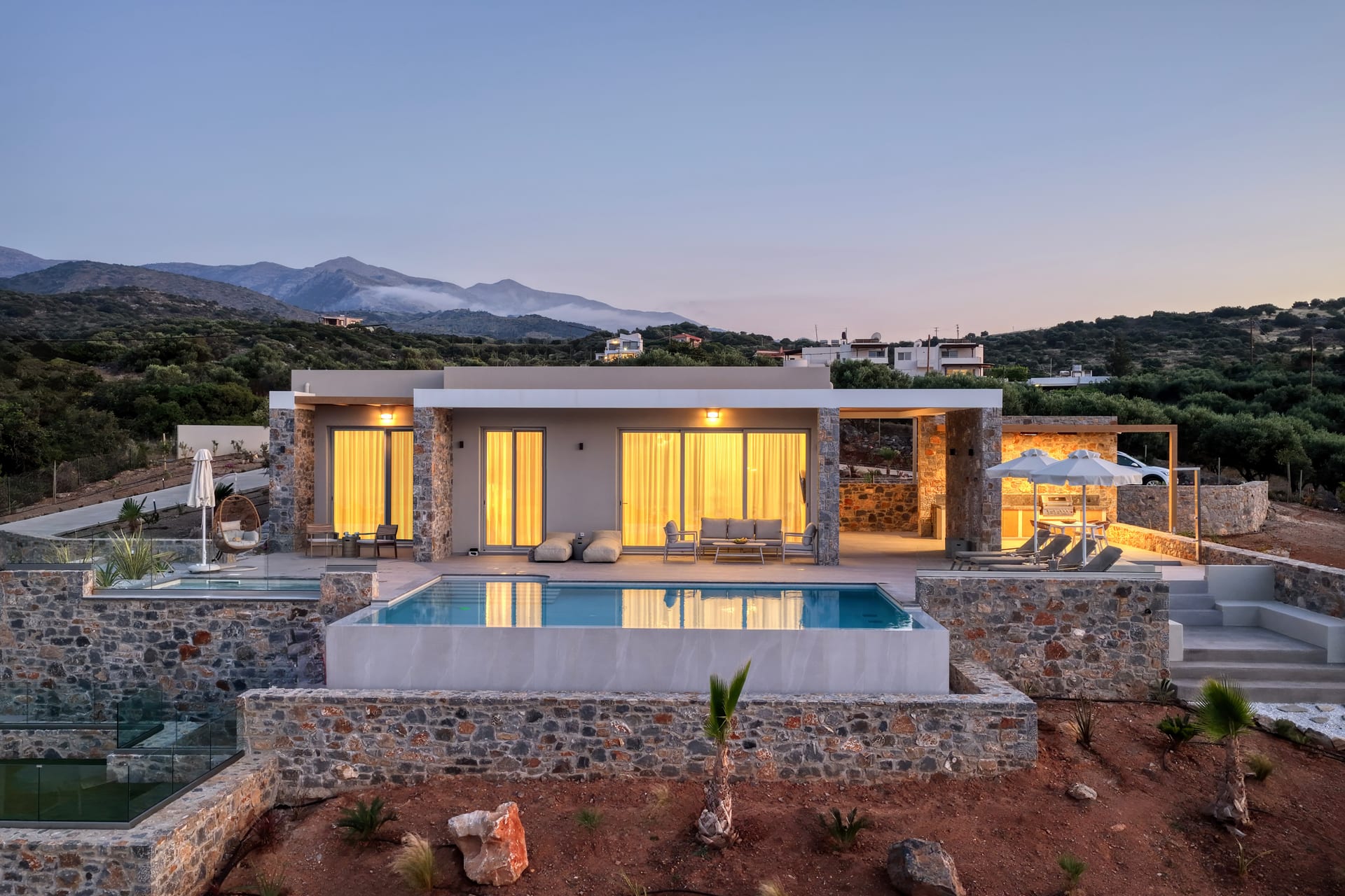 Villa at twilight with pool
